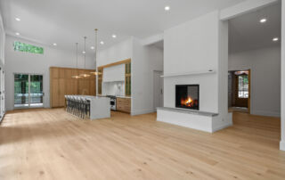 luxury new home with wooden floors, fireplace, and open concept home design