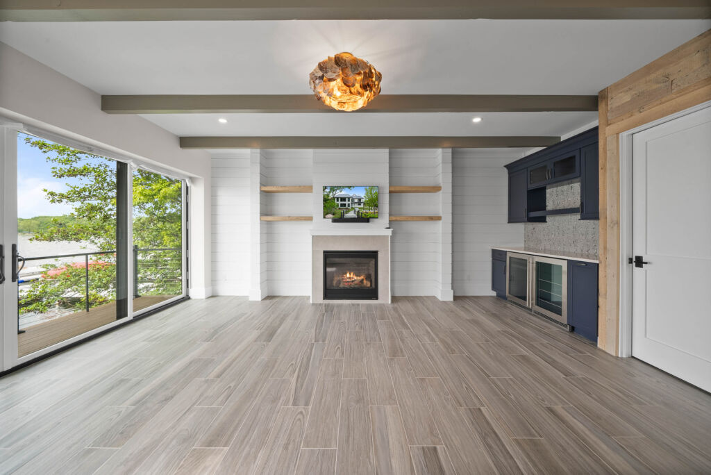 luxury living area with wooden floors, fireplace, and open concept home design 